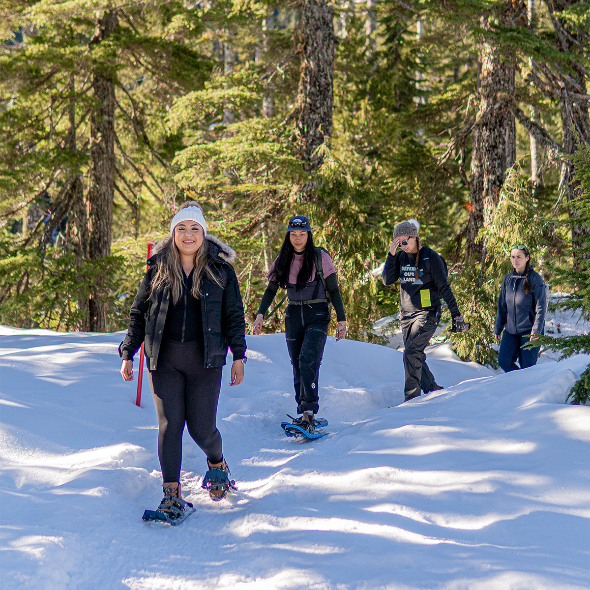 indigenous women outdoors snowshoeing talaysay tours bowen island x