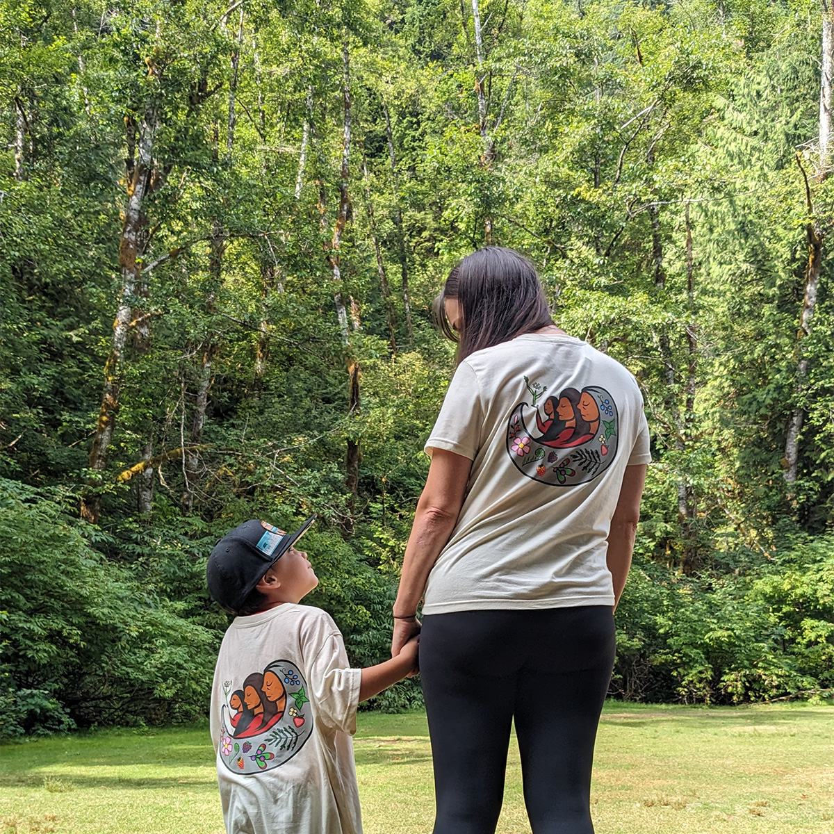 indigenous women outdoors harvesting hover x