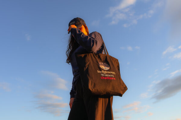 Indigenous women outdoors merch black large zip tote featured x
