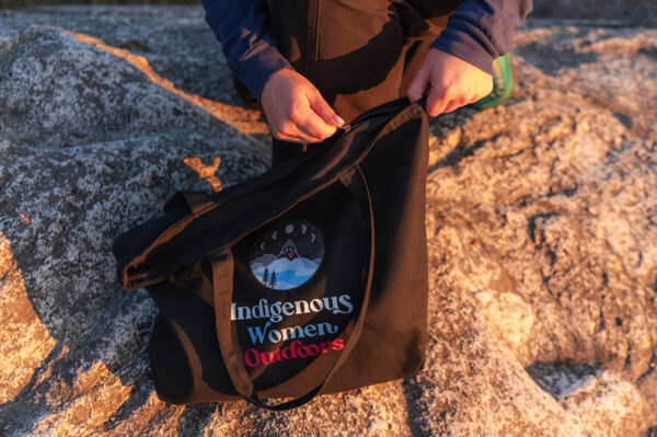 Indigenous women outdoors merch black large zip tote featured x