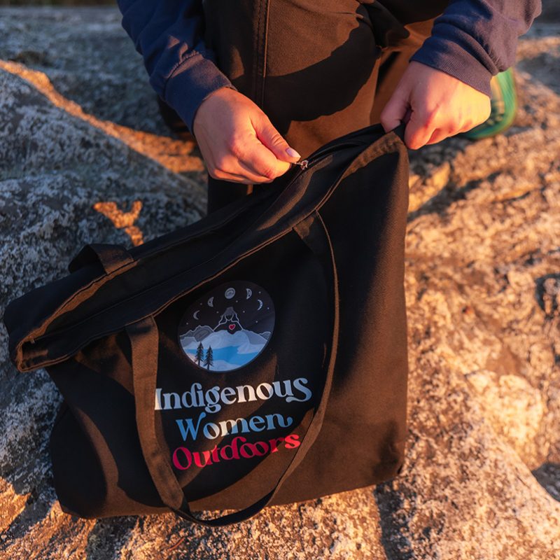 Indigenous women outdoors merch black large zip tote featured x